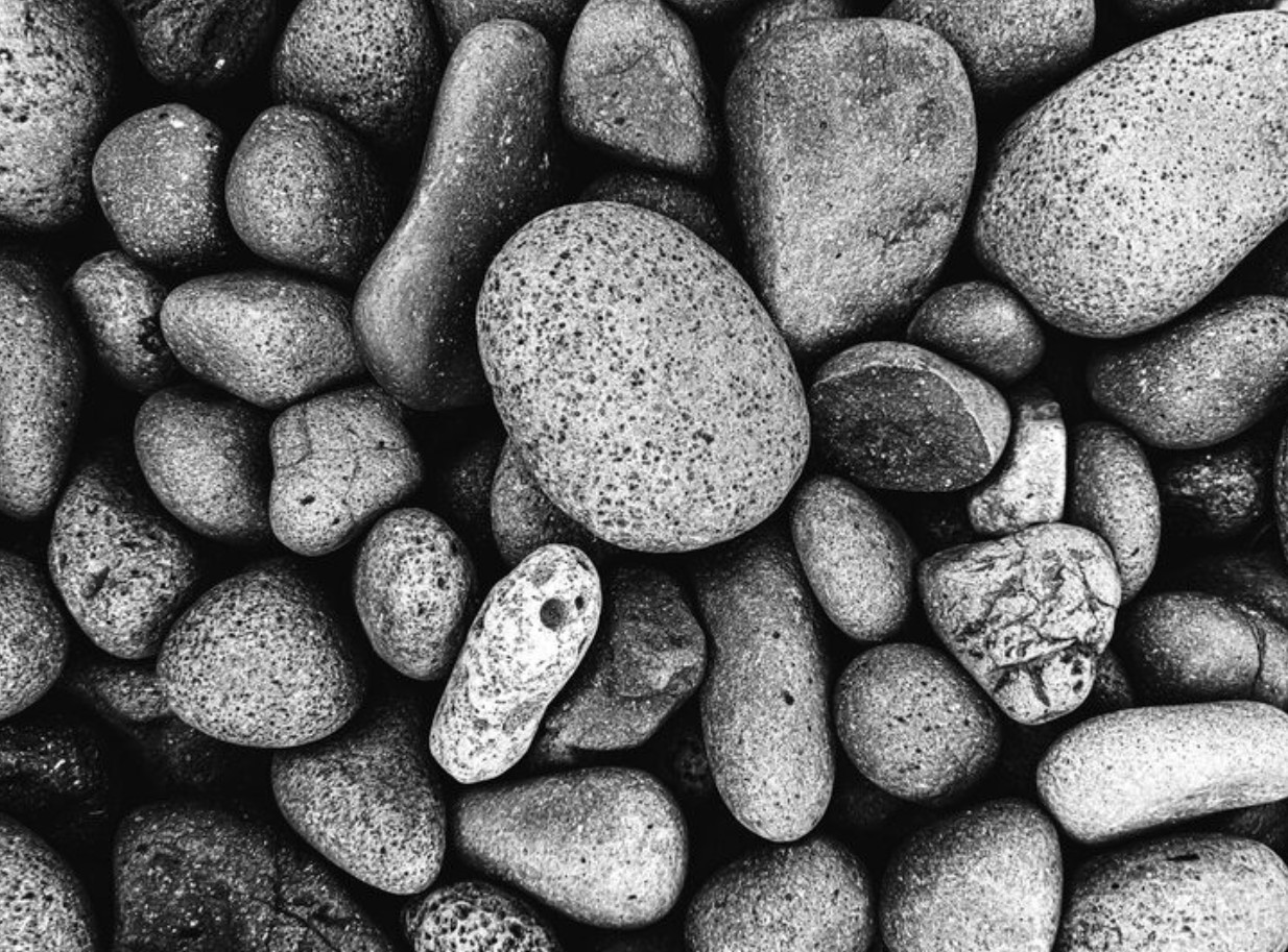 an assortment of river stones smoothed by water