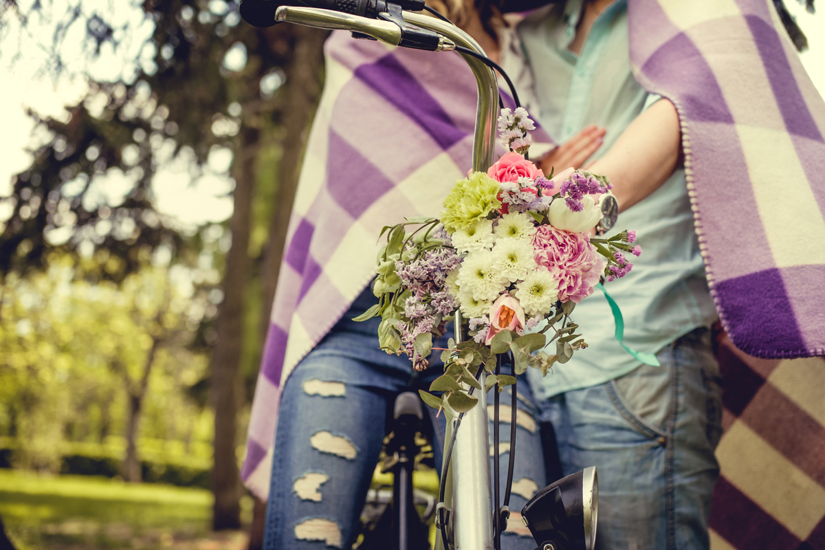 Christchurch Wedding Celebrant: couple getting married with flowers and bike